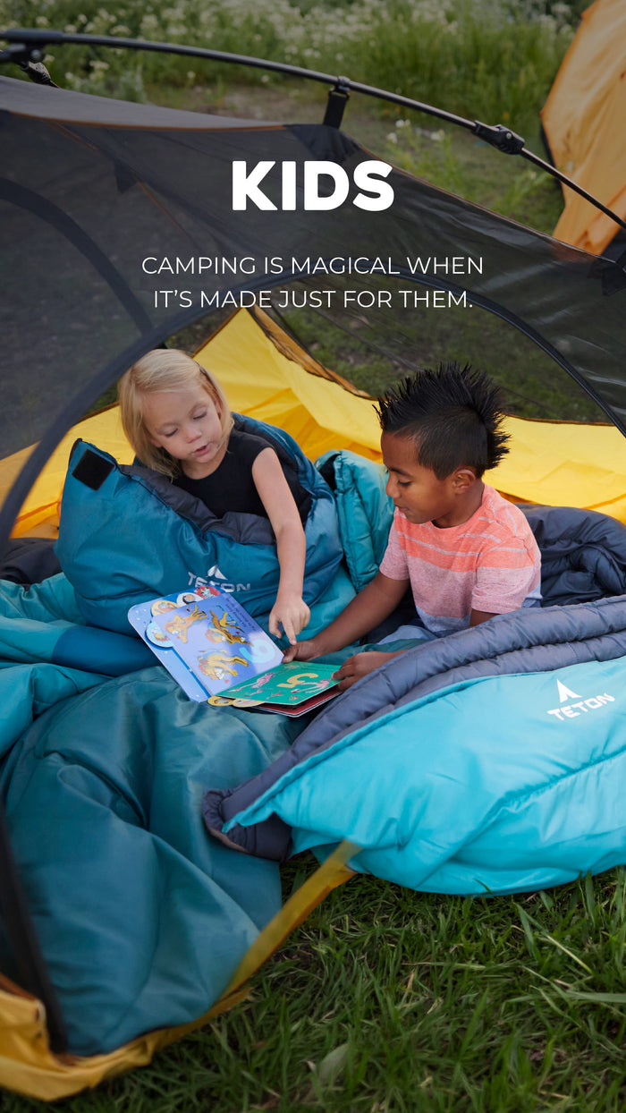 Kids Camping Solutions: Two children reading books in a camping tent with text 'KIDS: Camping is magical when it's made just for them.'
