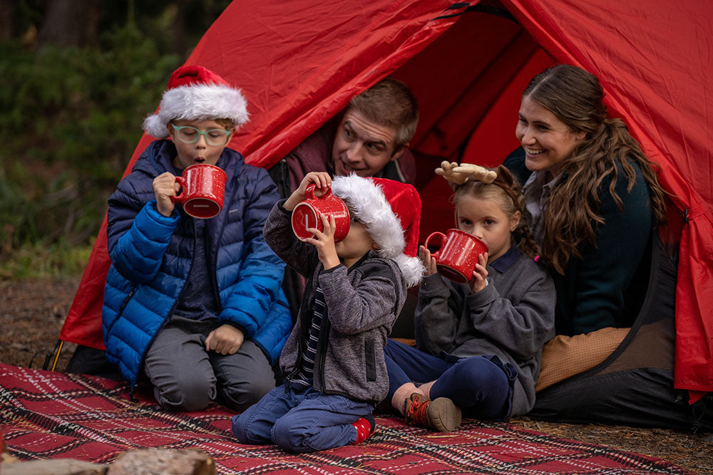 Family in their Mountain Ultra tent with santa hats