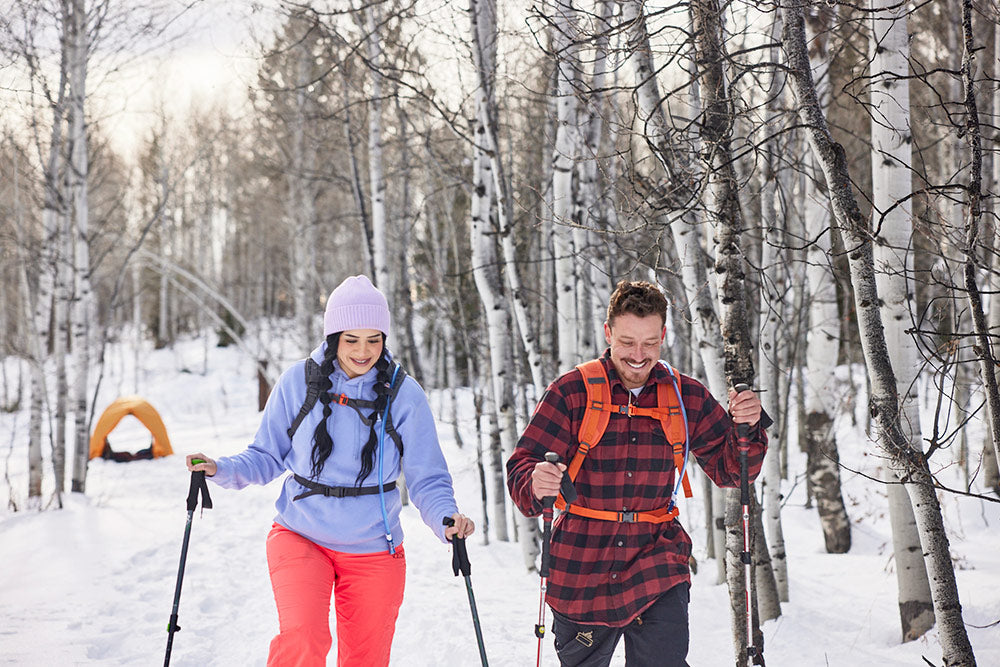 Couple snow shoes together in winter.