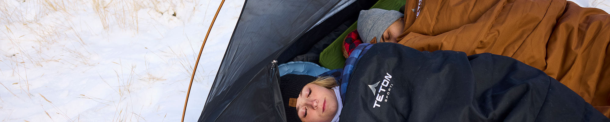 Deer Hunter sleeping bags being used for winter camping