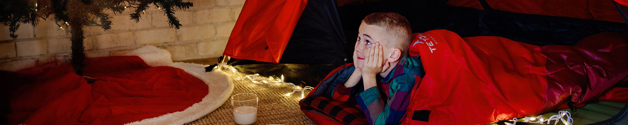 A child in his Celsius sleeping bag waiting for Santa to come