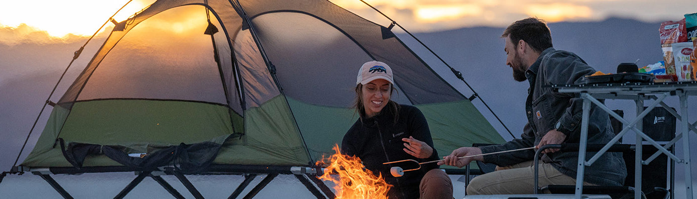 A couple camps on the Utah salt flats with their TETON Sports Vista Tent Bundle.