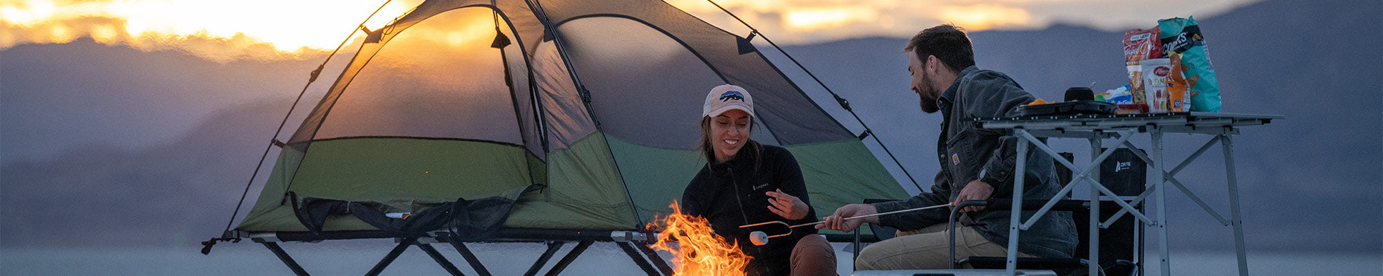 A couple camps on the Utah salt flats with their TETON Sports Vista Tent Bundle.