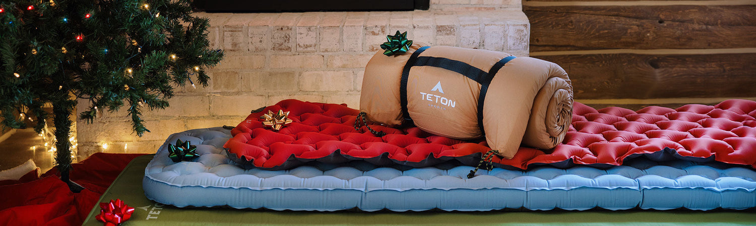 Canvas camp pad in a pile of gifts under a Christmas tree