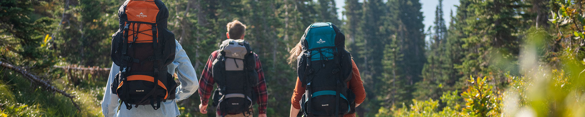 Friends hiking with their Scout & Explorer packs