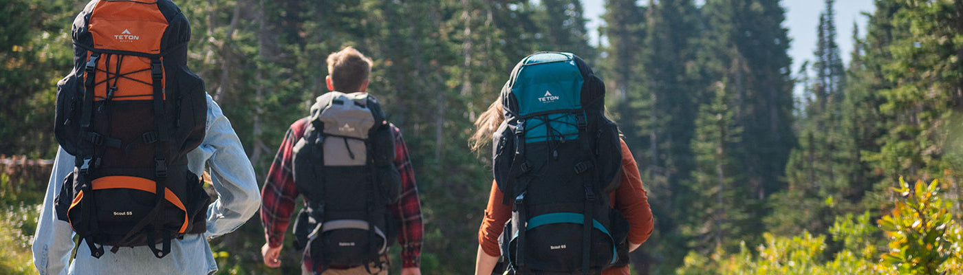 Friends hiking with their Scout & Explorer packs