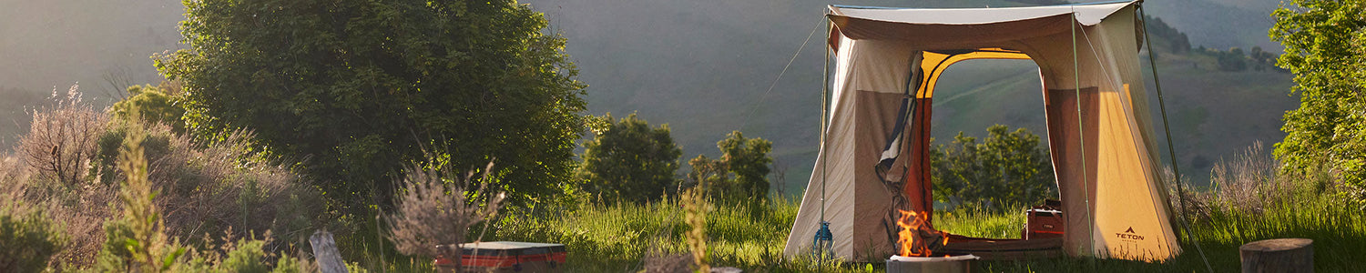 A TETON Sports Mesa Tent in a green mountainous location.