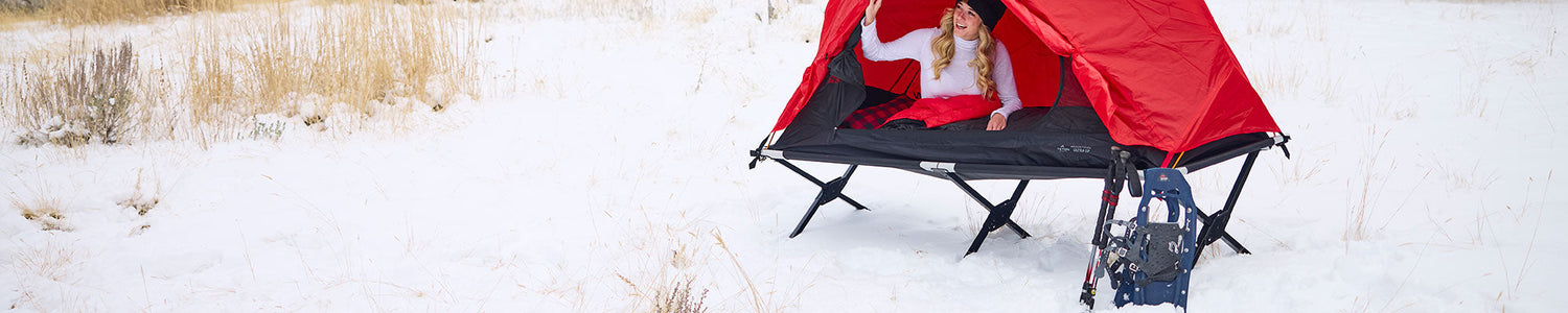 Camp cot and tent being used for winter camping