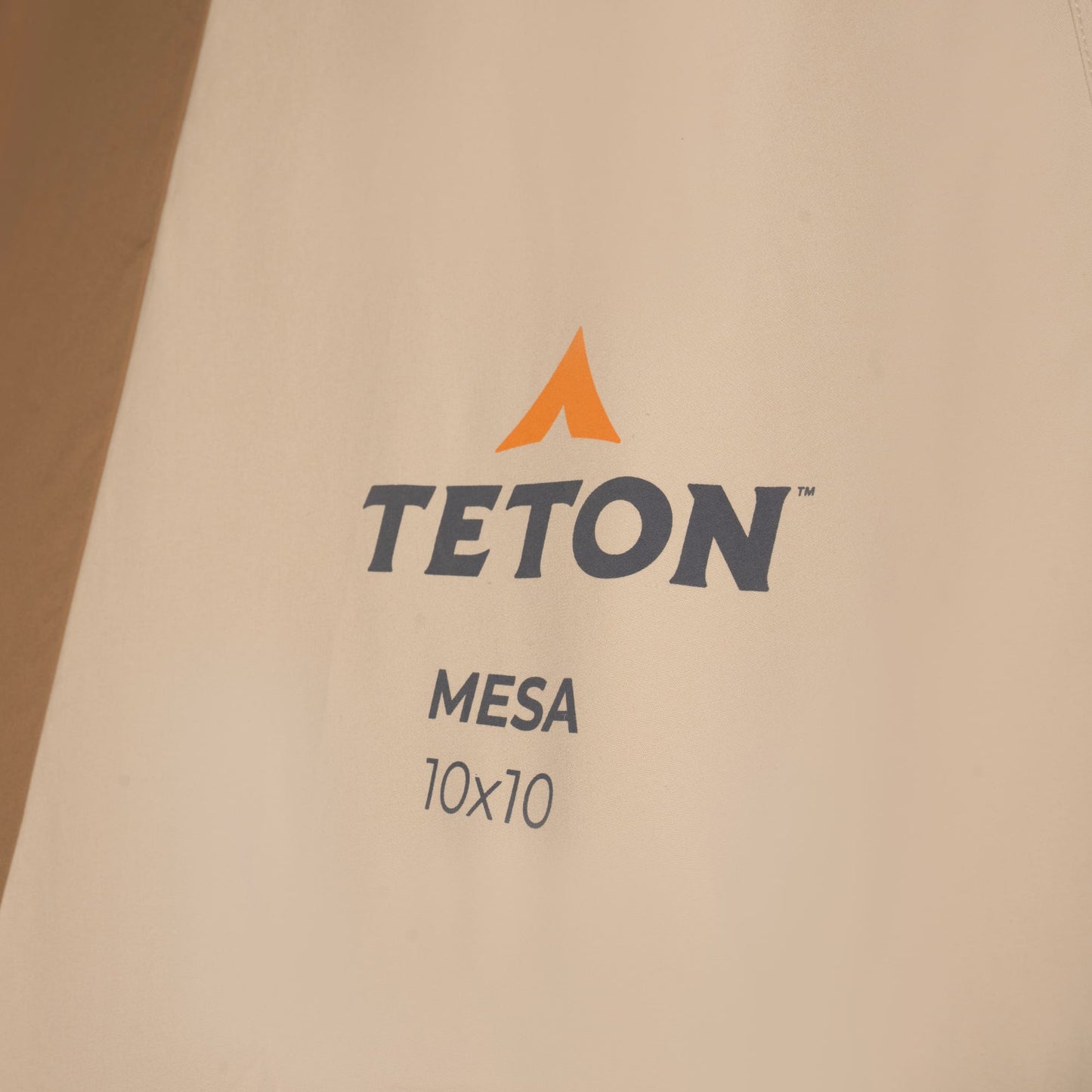 Teton Mesa 10x10 logo on a beige background
