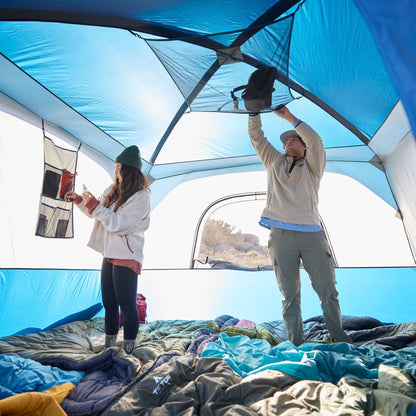 A man & woman standing up inside the tent at a height of 6 foot