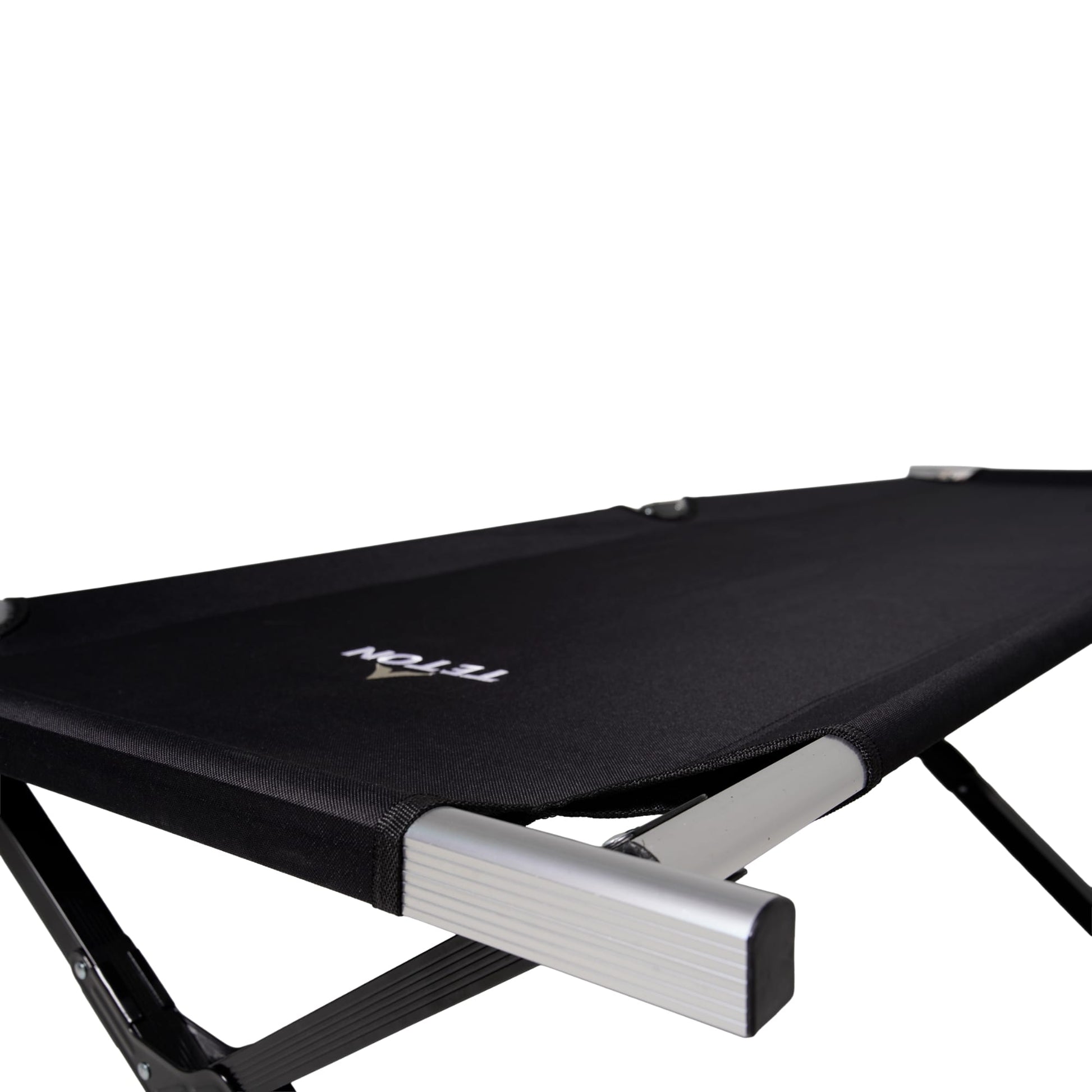 Black camping cot with metal frame on a white background