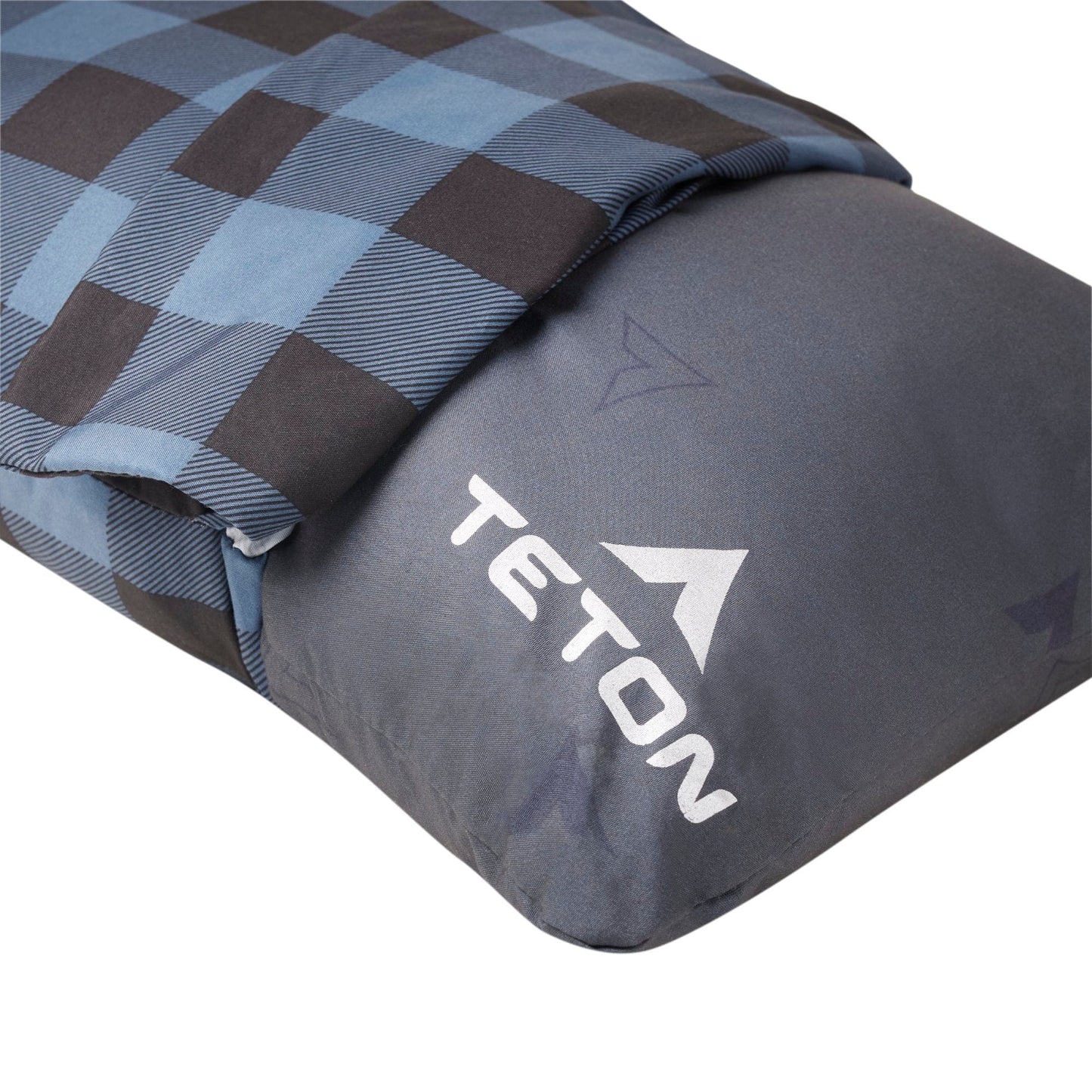 Gray sleeping bag with blue checkered cover and TETON logo on a white background