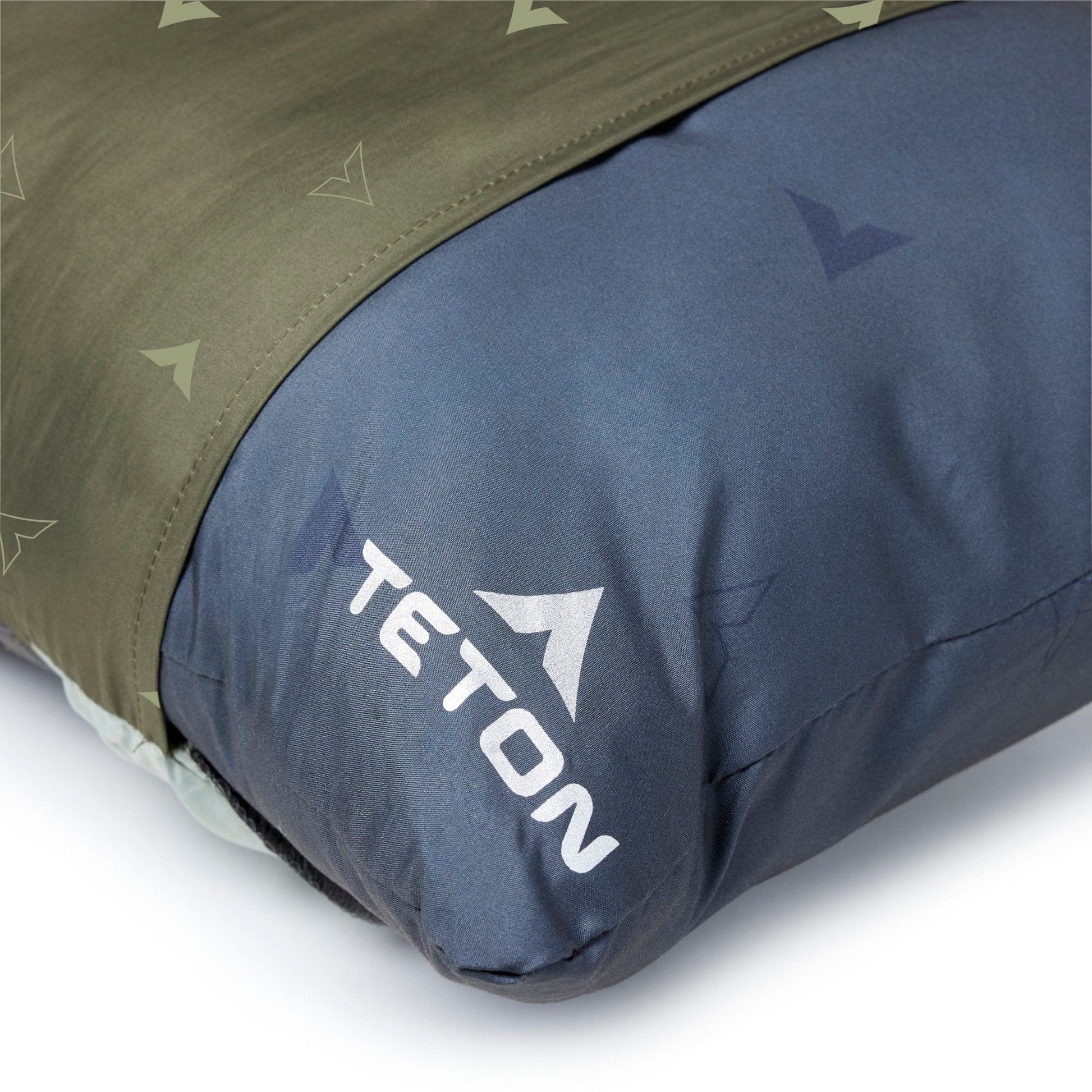 Close-up of a sleeping bag with TETON logo on a white background