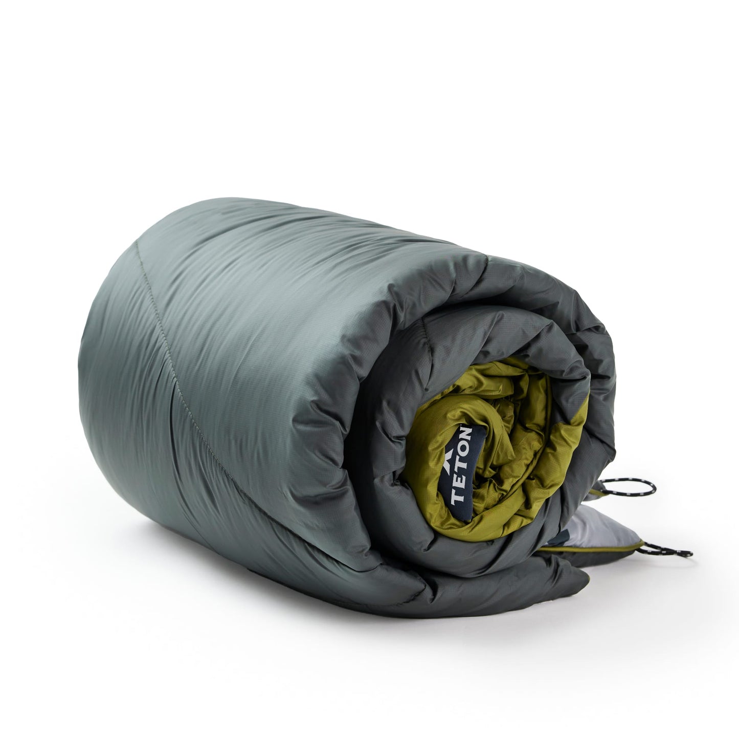 Rolled green outdoor blanket with Teton brand logo on a white background