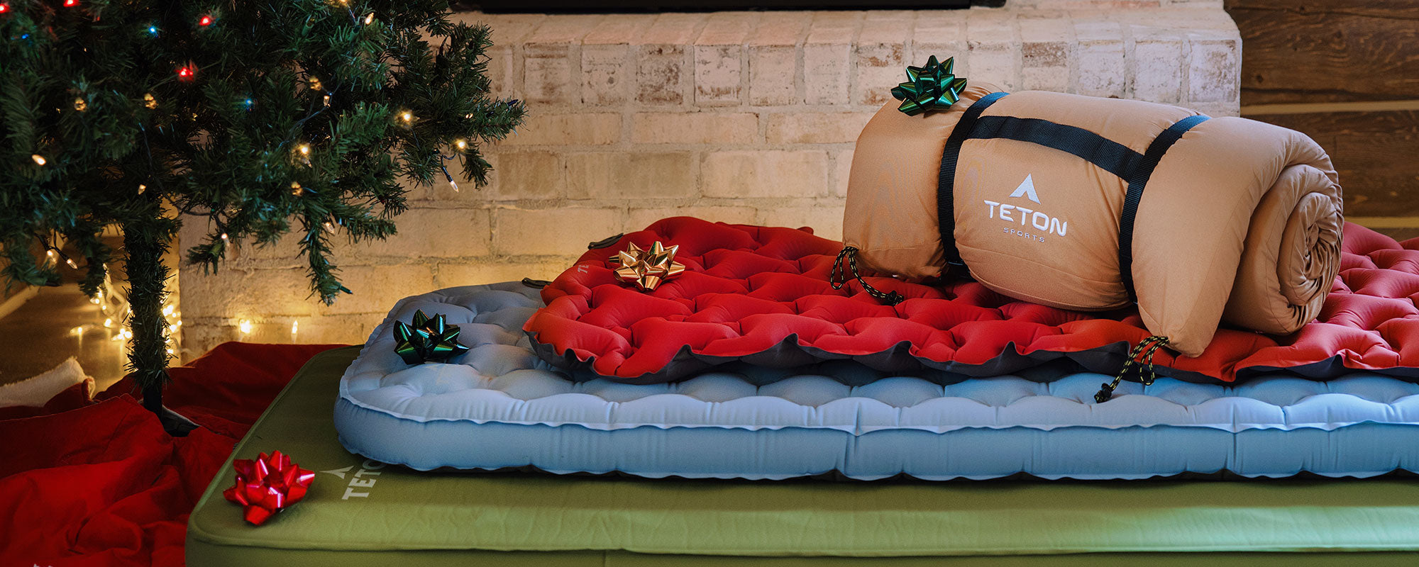 A stack of camp pads under the Christmas tree