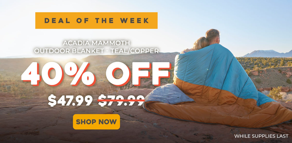 Promotional outdoor ad showing a couple wrapped in an outdoor blanket on a desert landscape, with large text reading 'DEAL OF THE WEEK', '40% OFF', '$47.99