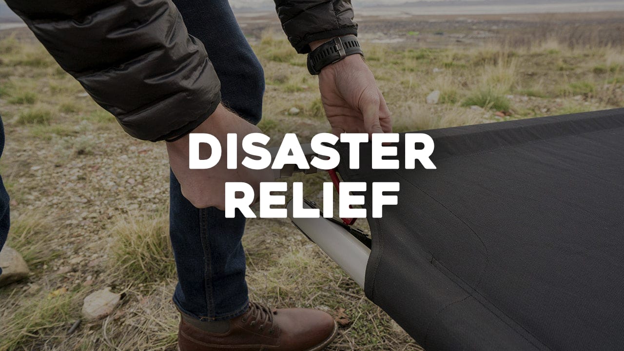 Person setting up the camping cot with 'Disaster Relief' text overlay in an outdoor setting.
