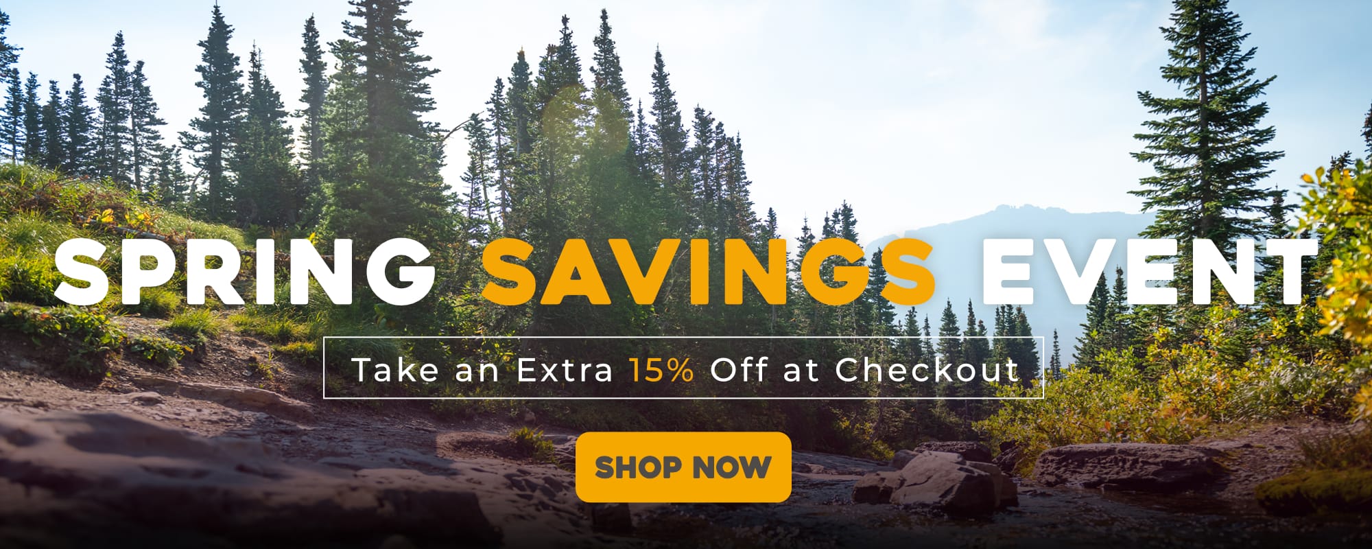 Spring savings event banner with a scenic background of trees and mountains. Take an extra 15% OFF at checkout.
