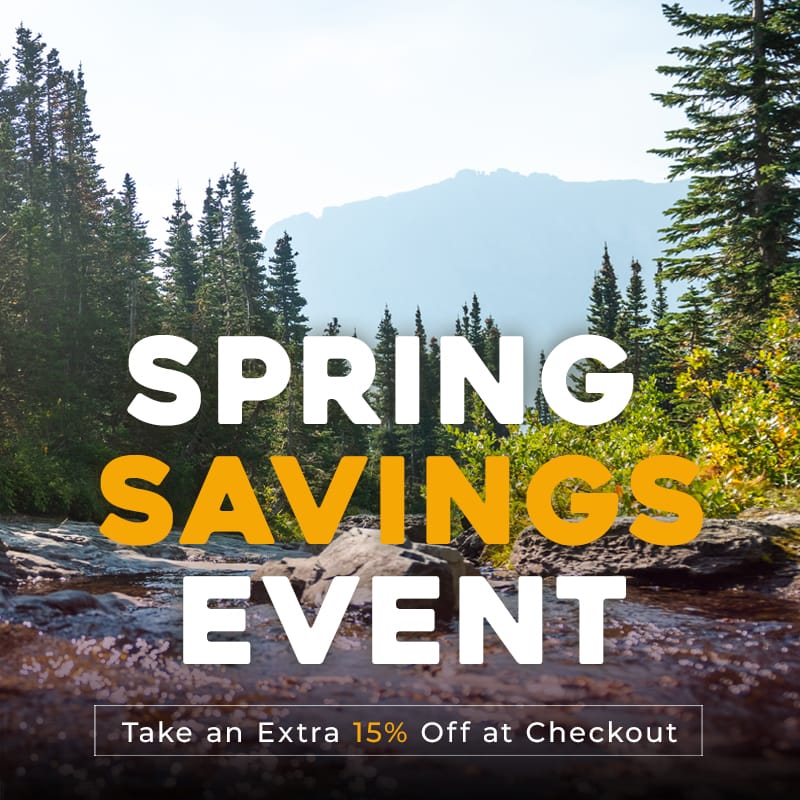 Spring savings event banner with a scenic background of trees and mountains. Take an extra 15% OFF at checkout.