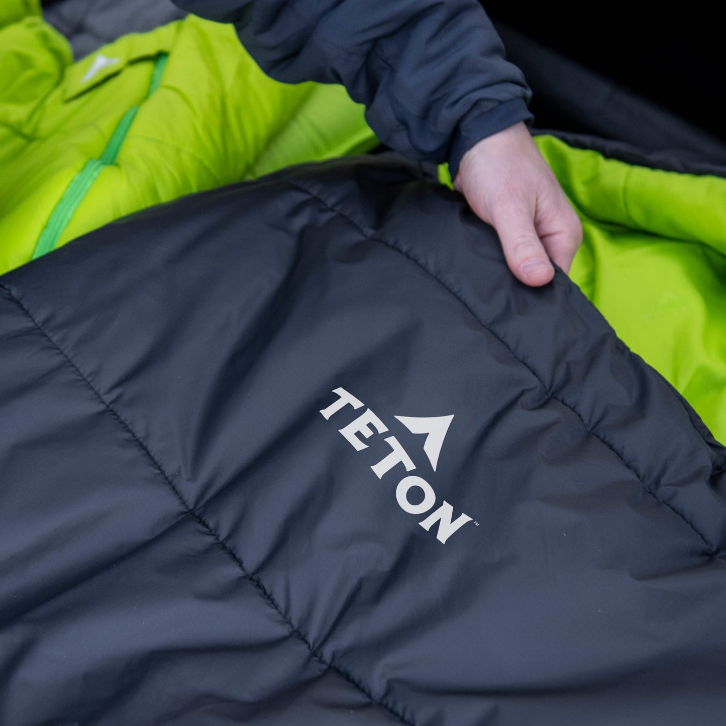 Black mummy sleeping bag with TETON logo 