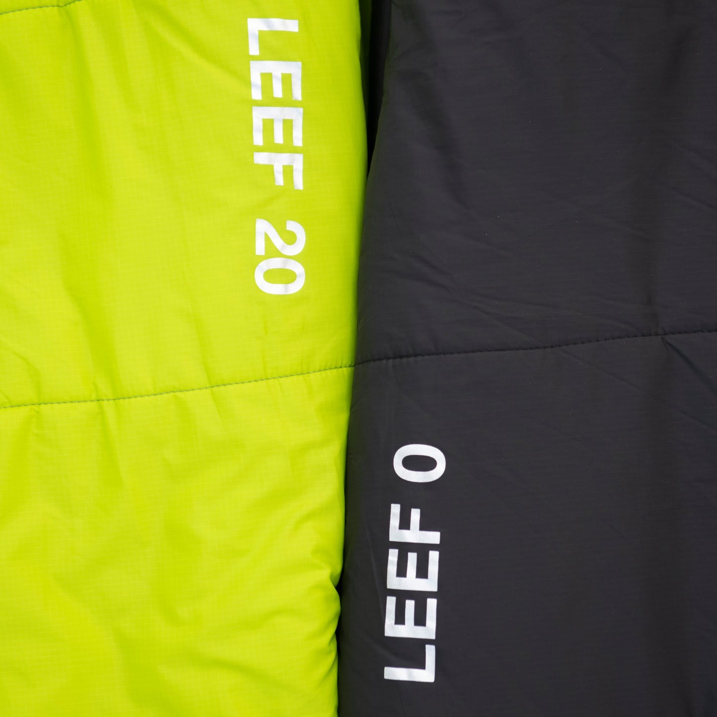 Close-up of green LEEF 20 and black LEEF 0 sleeping bags 