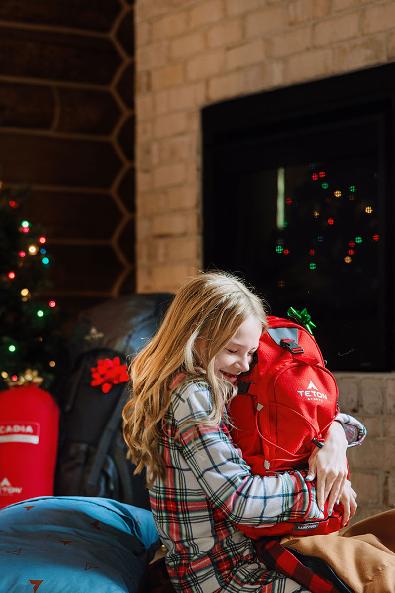 A girl with her Oasis hydration pack for the holidays